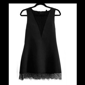 Little black dress with lace inserts and trim